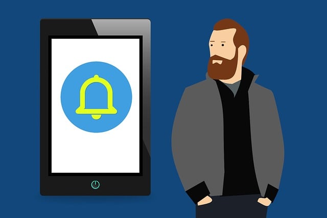 注意を促す標識とスマートフォン